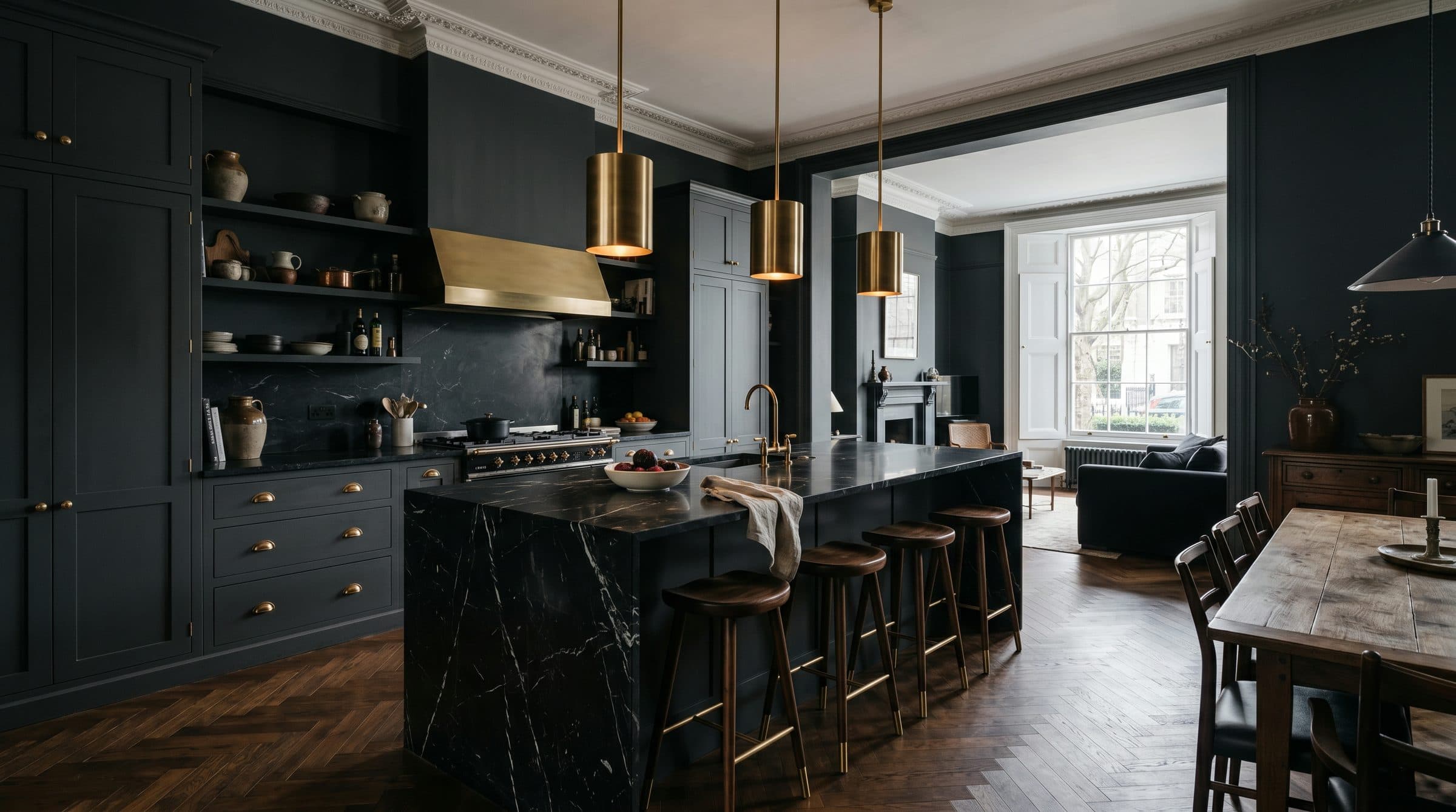 Kitchen renovation in a London townhouse by ERCO Home Improvements — dark cabinetry, marble worktop and brass pendant lights